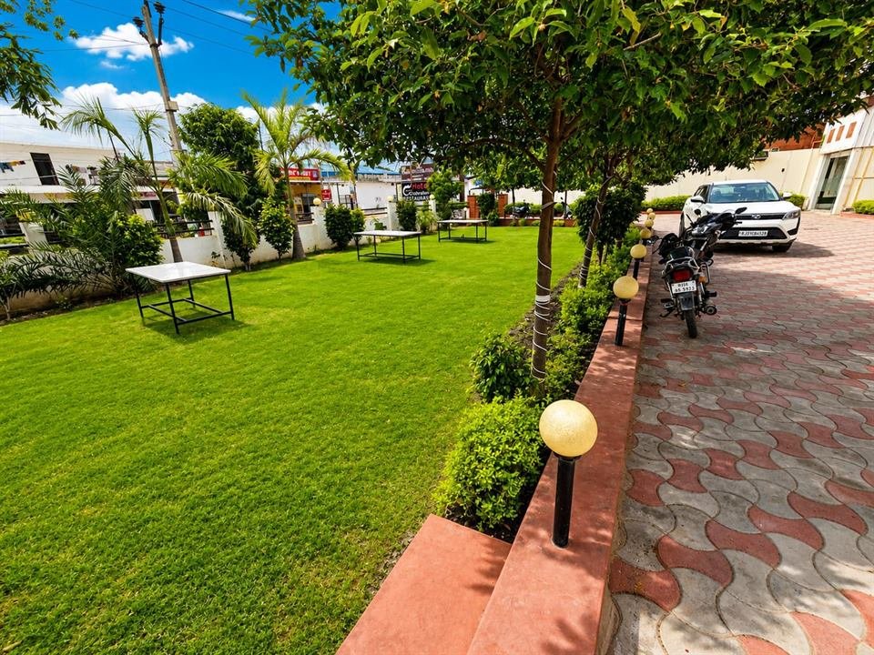 Front lawn and driveway with lamp posts